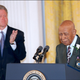WASHINGTON, : Ninety-four-year-old Herman Shaw (R) speaks as US President Bill Clinton looks on during ceremonies at the White House in Washington 16 May in which Clinton apologized to the survivors and families of the victims of the Tuskegee Syphilis Study. Shaw and nearly 400 other black men were part of a government study that followed the progress of syphilis and were told that they were being treated, but were actually given only a placebo.